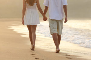 couple walking on St Kilda beach